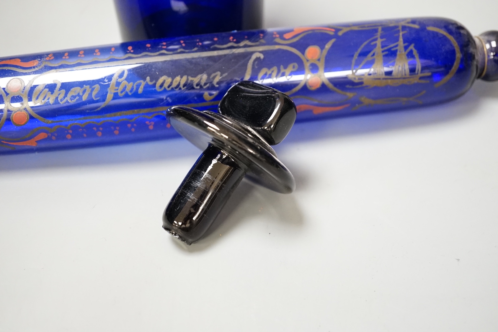 A Victorian cobalt blue glass apothecary jar and a rolling pin (2)